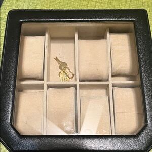 Wolf leather bracelet watch case organizers with glass top and key.